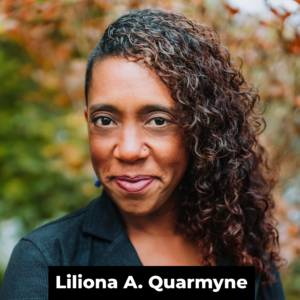 A Black woman with her head half shaved, half full of long curly hair, smiles at the camera in front of some foliage. At the bottom of the image in a black rectangle, the words 'Liliona A. Quarmyne' in white text.